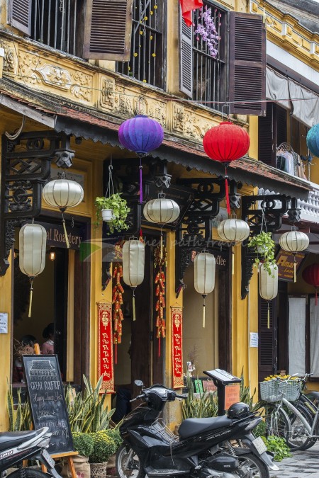 Old yellow rendered buildings and colorful silk lanterns in Hoi An