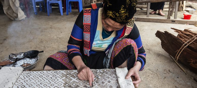 Ha Giang - woman using wax method to create patterned hemp cloth